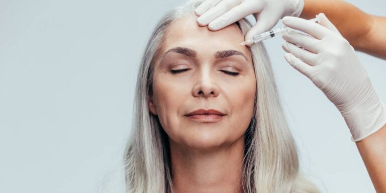 Senior woman getting cosmetic injection